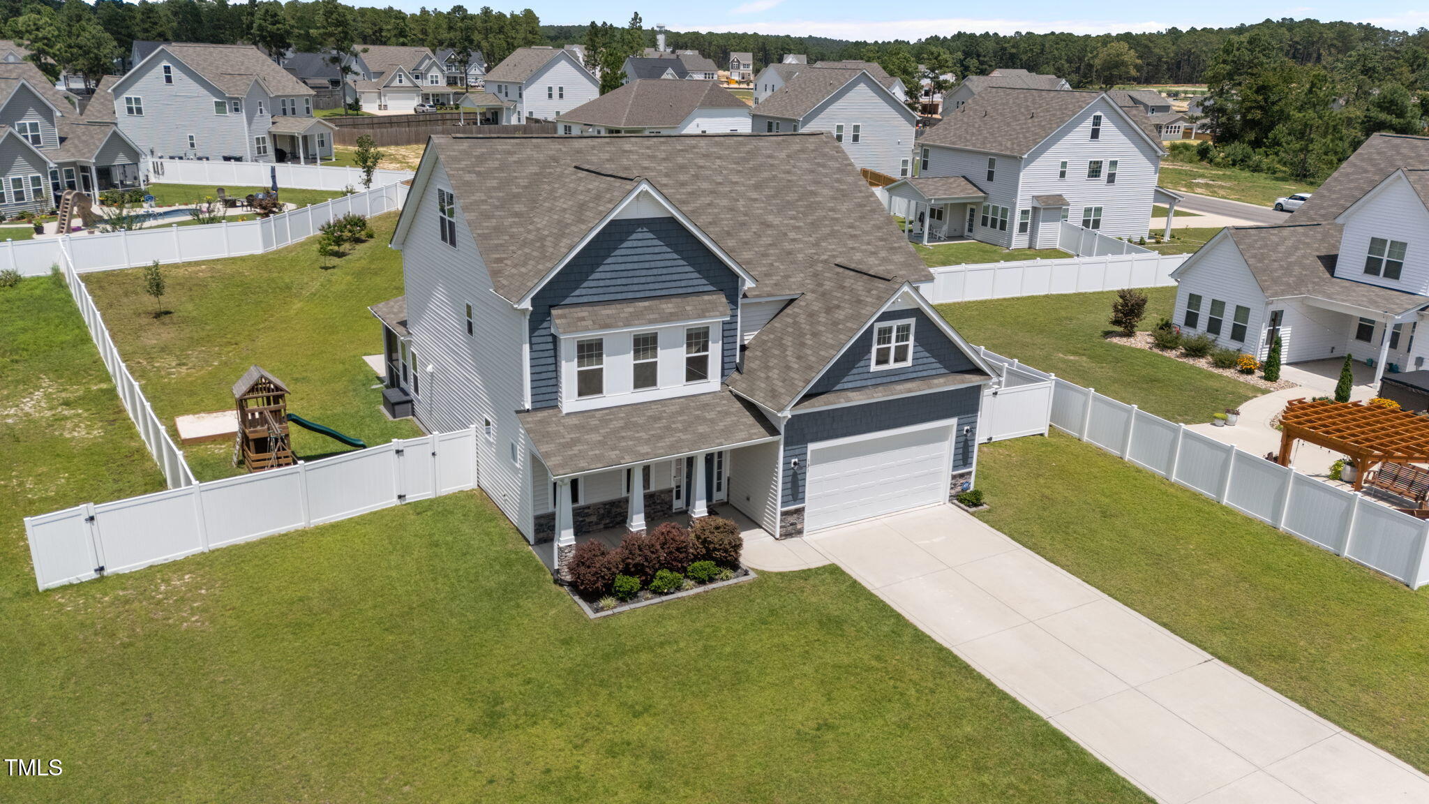 131 Sandy Springs Road Aberdeen, NC 28315 - Photo 55 of 61 an aerial view of a house with swimming pool