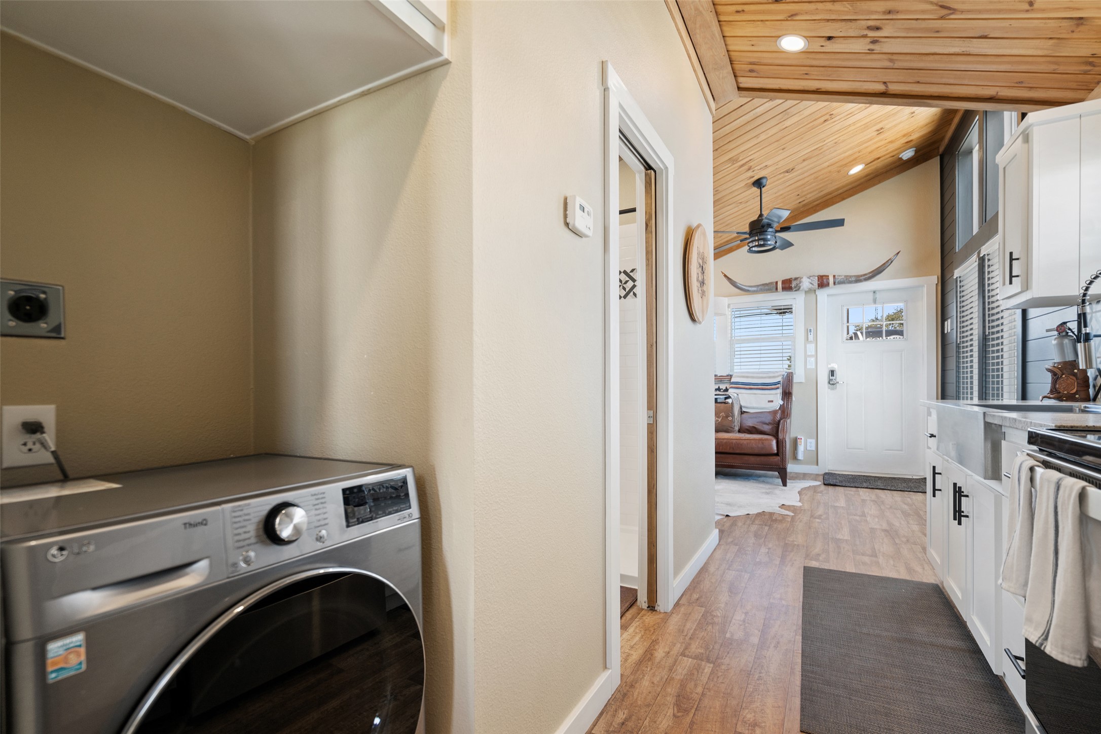 5386 Ranch Road 1376, Unit 50 Fredericksburg, TX 78624 - Photo 11 of 32 a view of a hallway with washer and dryer