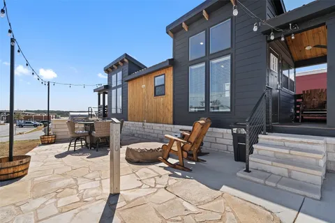 a view of a patio with a table and chairs