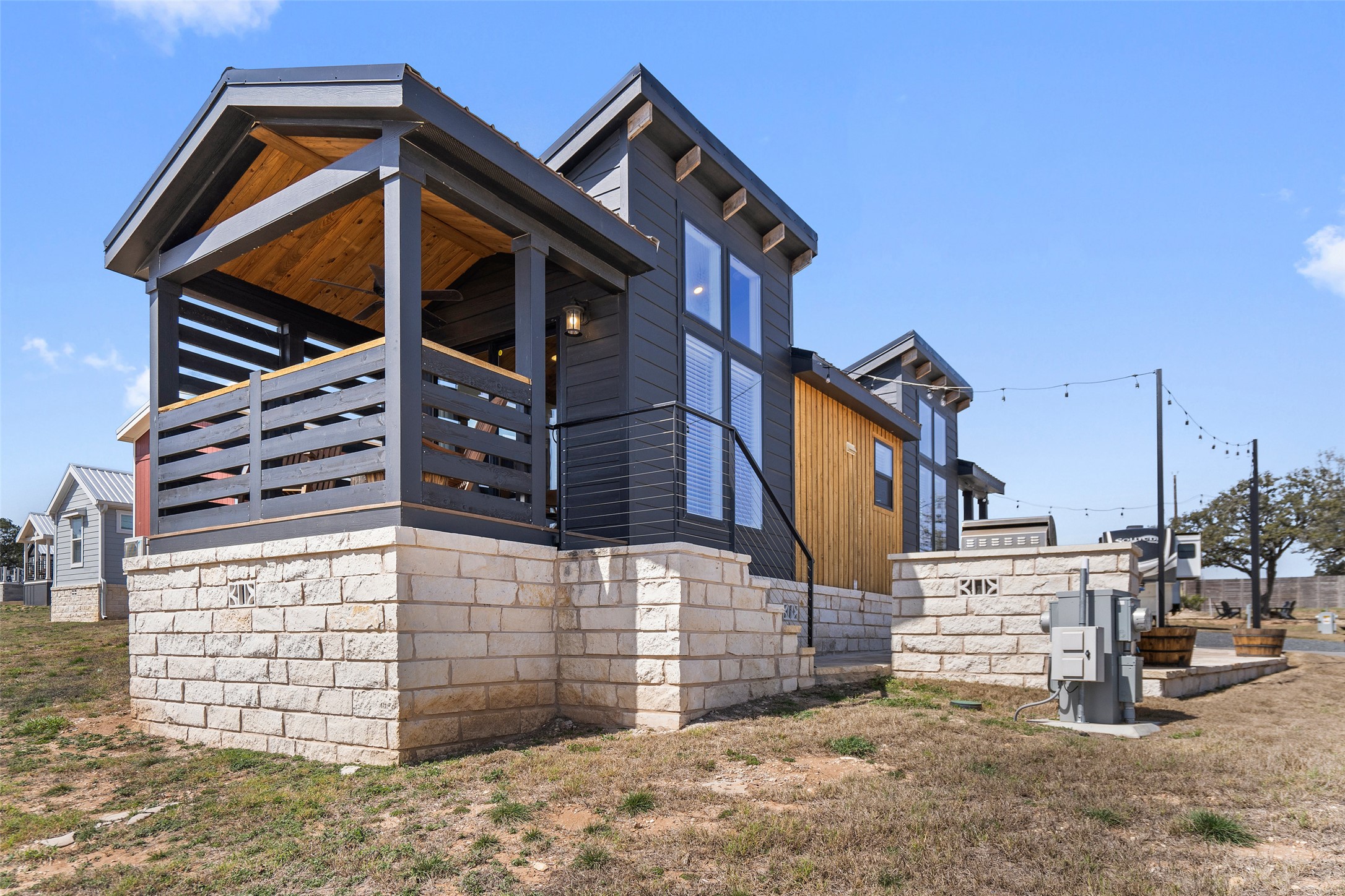 5386 Ranch Road 1376, Unit 50 Fredericksburg, TX 78624 - Photo 23 of 32 a view of a house with a wooden fence