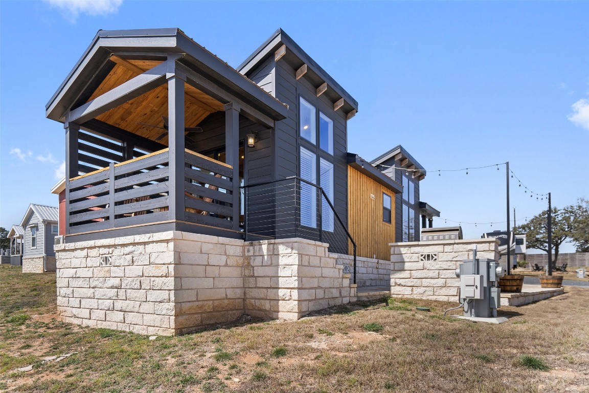 5386 Ranch Road 1376, Unit 50 Fredericksburg, TX 78624 - Photo 23 of 32 a view of a house with a wooden fence