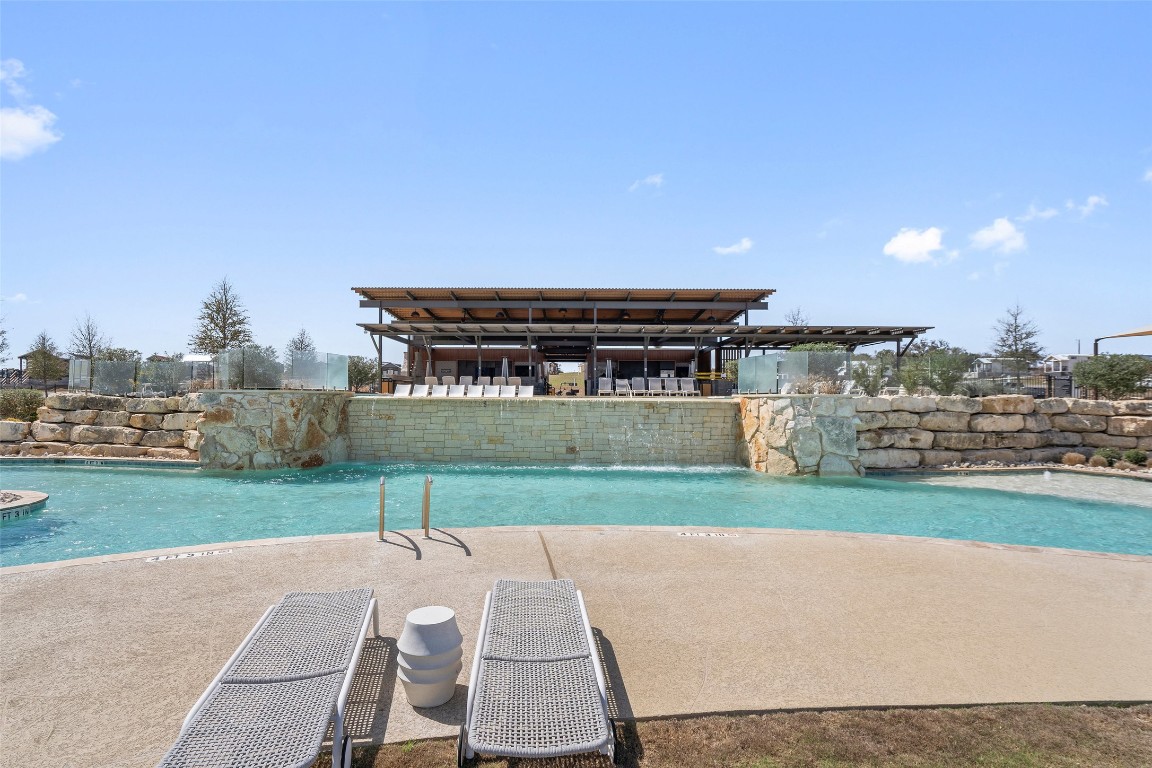 5386 Ranch Road 1376, Unit 50 Fredericksburg, TX 78624 - Photo 26 of 32 a view of a house with a yard