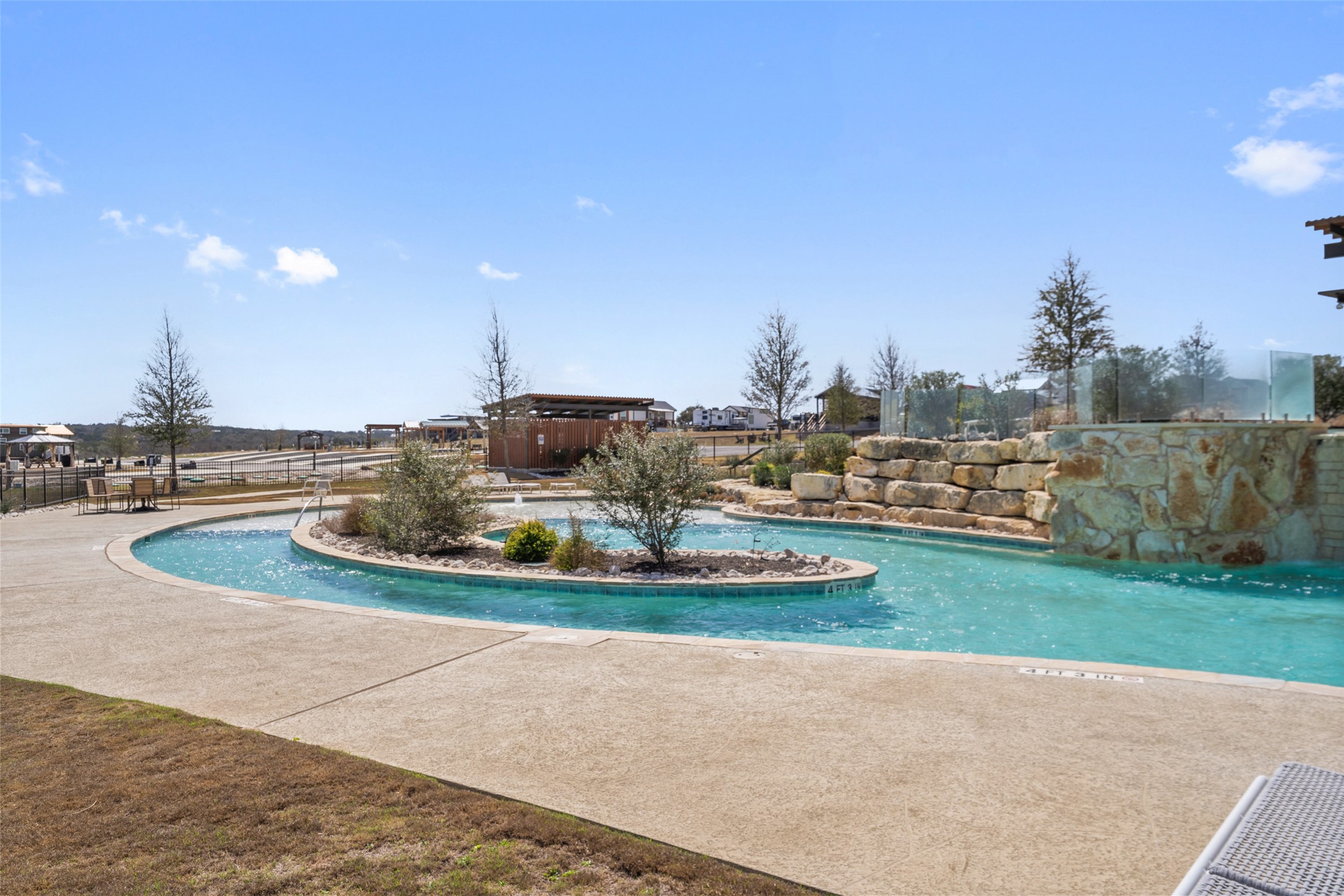 5386 Ranch Road 1376, Unit 50 Fredericksburg, TX 78624 - Photo 32 of 32 a view of a swimming pool with a yard