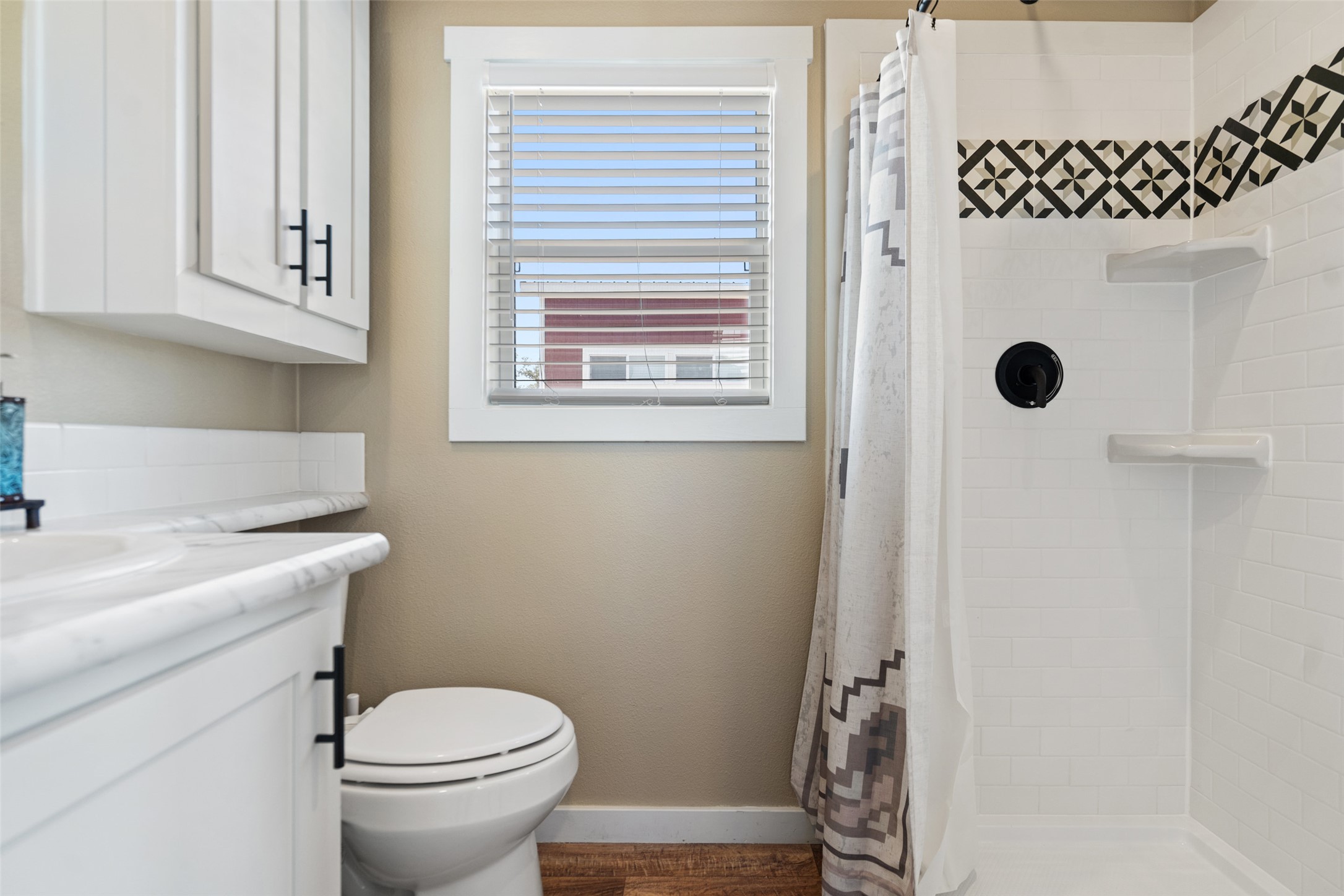 5386 Ranch Road 1376, Unit 50 Fredericksburg, TX 78624 - Photo 9 of 32 a bathroom with a sink a toilet and shower