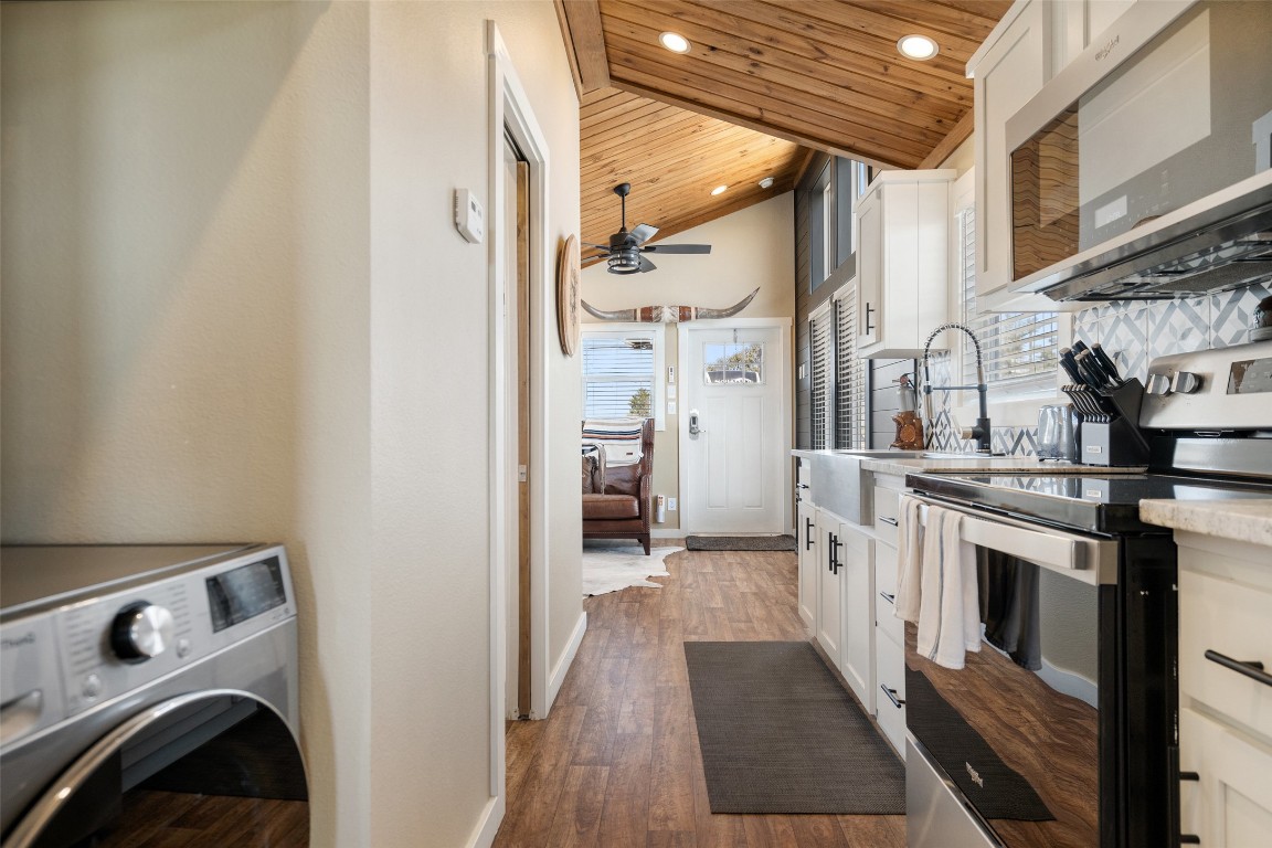 5386 Ranch Road 1376, Unit 50 Fredericksburg, TX 78624 - Photo 10 of 32 a view of a kitchen with stainless steel appliances granite countertop a refrigerator and a stove