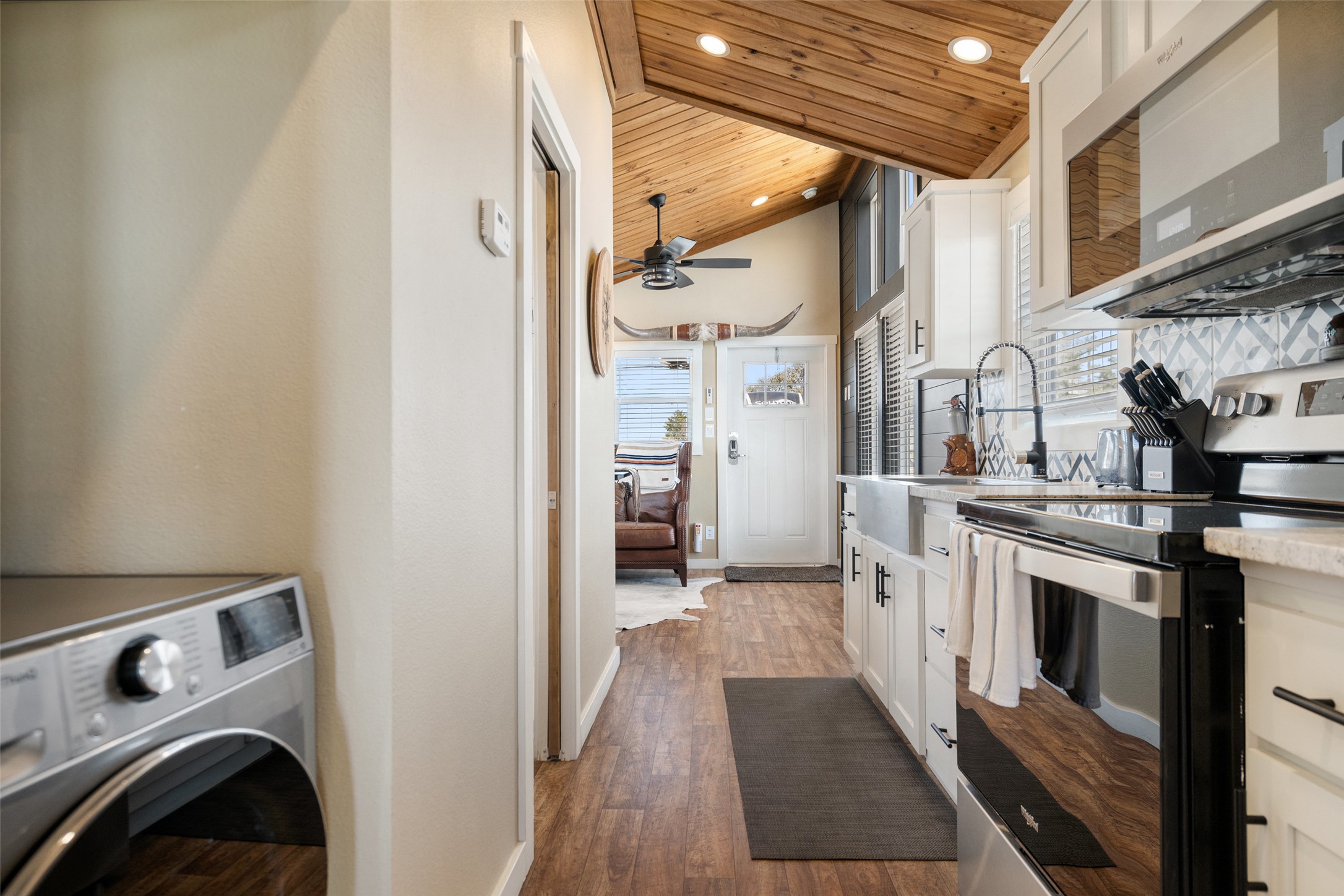 5386 Ranch Road 1376, Unit 50 Fredericksburg, TX 78624 - Photo 10 of 32 a view of a kitchen with stainless steel appliances granite countertop a refrigerator and a stove