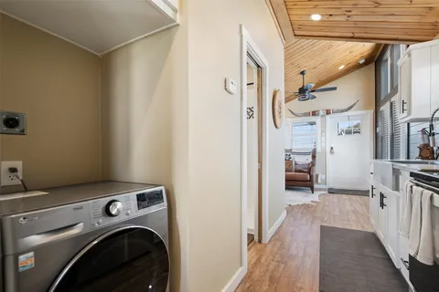 a view of a hallway with washer and dryer