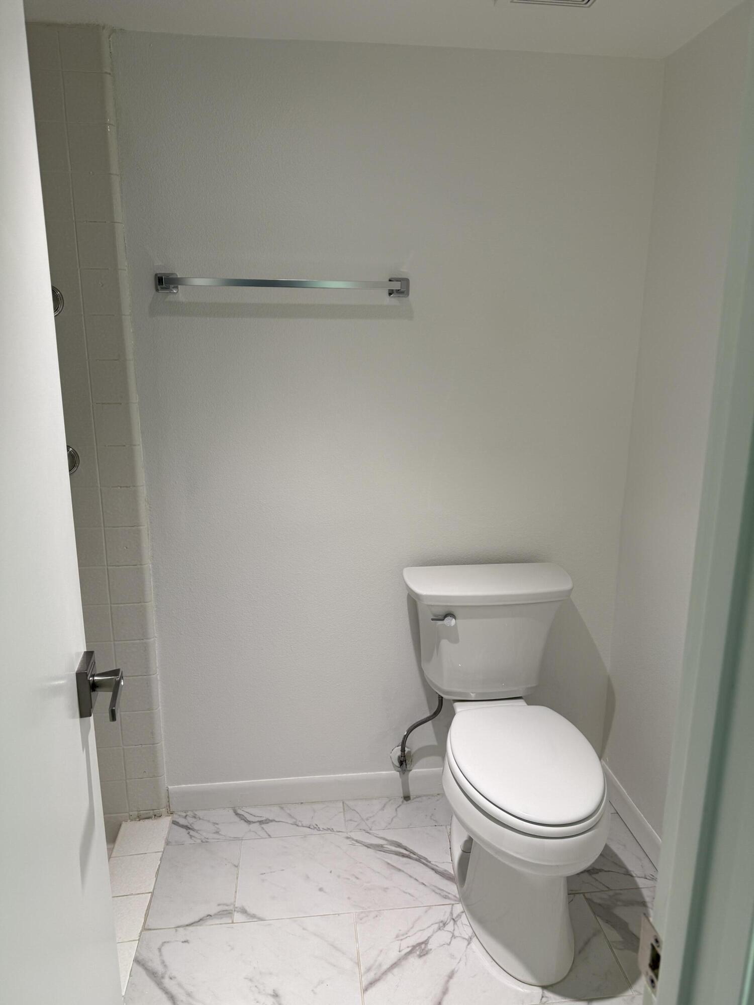 2017 Normandy Court Palm Springs, CA 92264 - Photo 13 of 17 a white toilet sitting next to a shower
