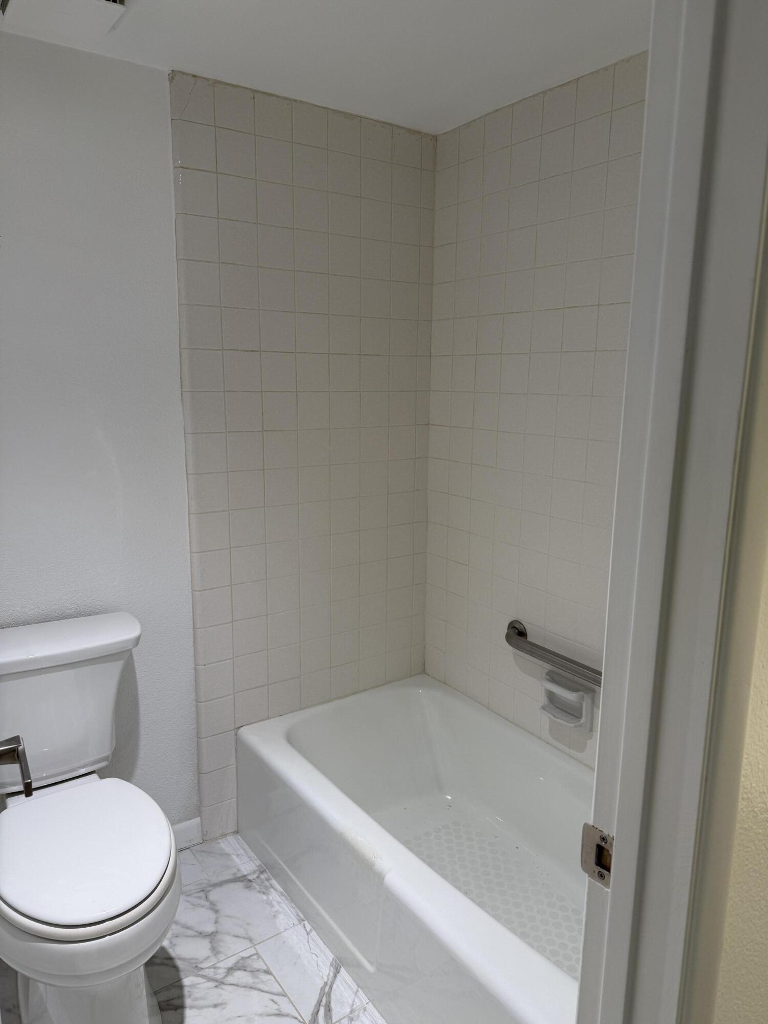2017 Normandy Court Palm Springs, CA 92264 - Photo 15 of 17 a white toilet sitting next to a bath tub