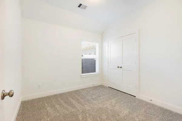 a view of a room that has a window in it