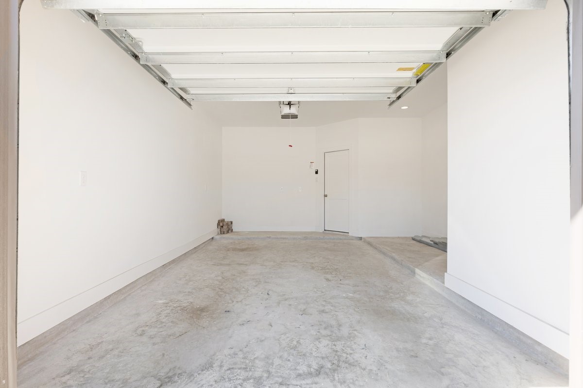 10122 Crescendo Way Manvel, TX 77578 - Photo 18 of 24 0ne car garage with extended space for storage. Long driveway for multiple vehicles plus additional puble parking spots in the cul-de-sac.