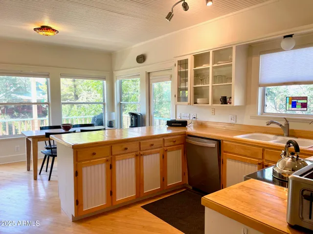 a kitchen with a refrigerator sink and stove