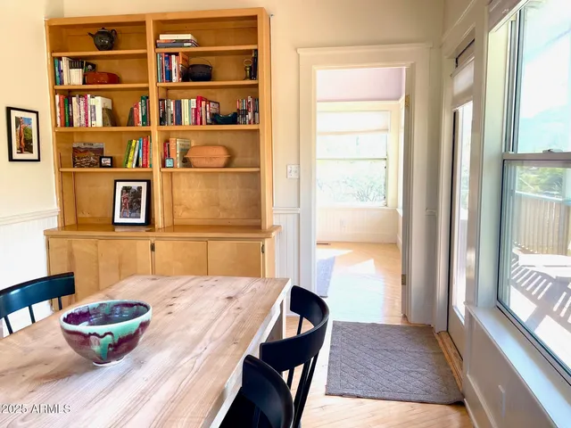 a view of an empty room and a window
