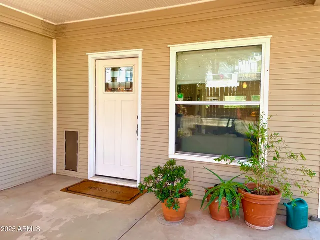 a front view of a house with outdoor seating