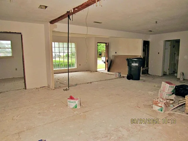 a bedroom with furniture and a chandelier