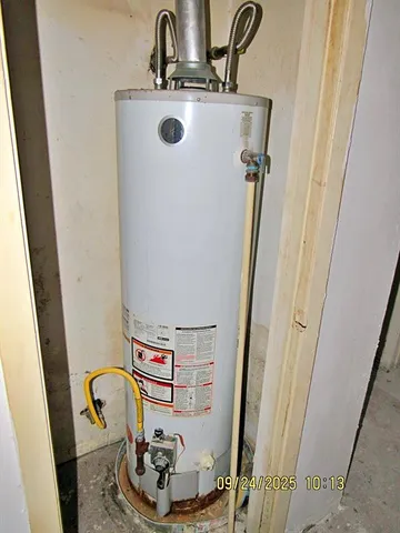 a room with water heater and a sink