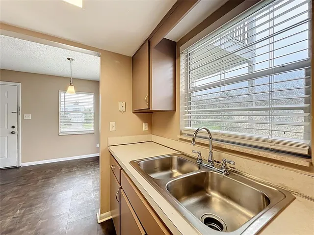 a kitchen with a sink and a window