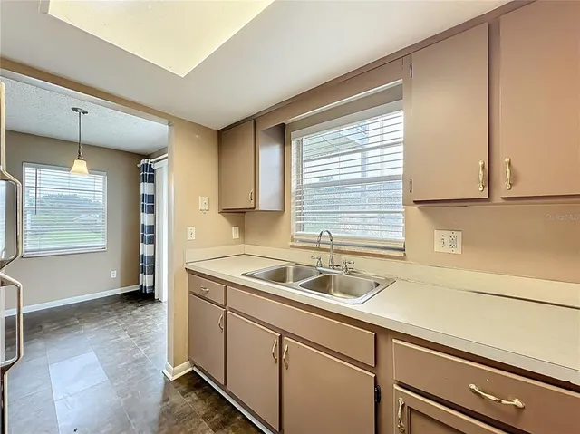 a kitchen with a sink and cabinets