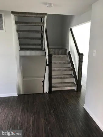 a view of entryway with wooden floor