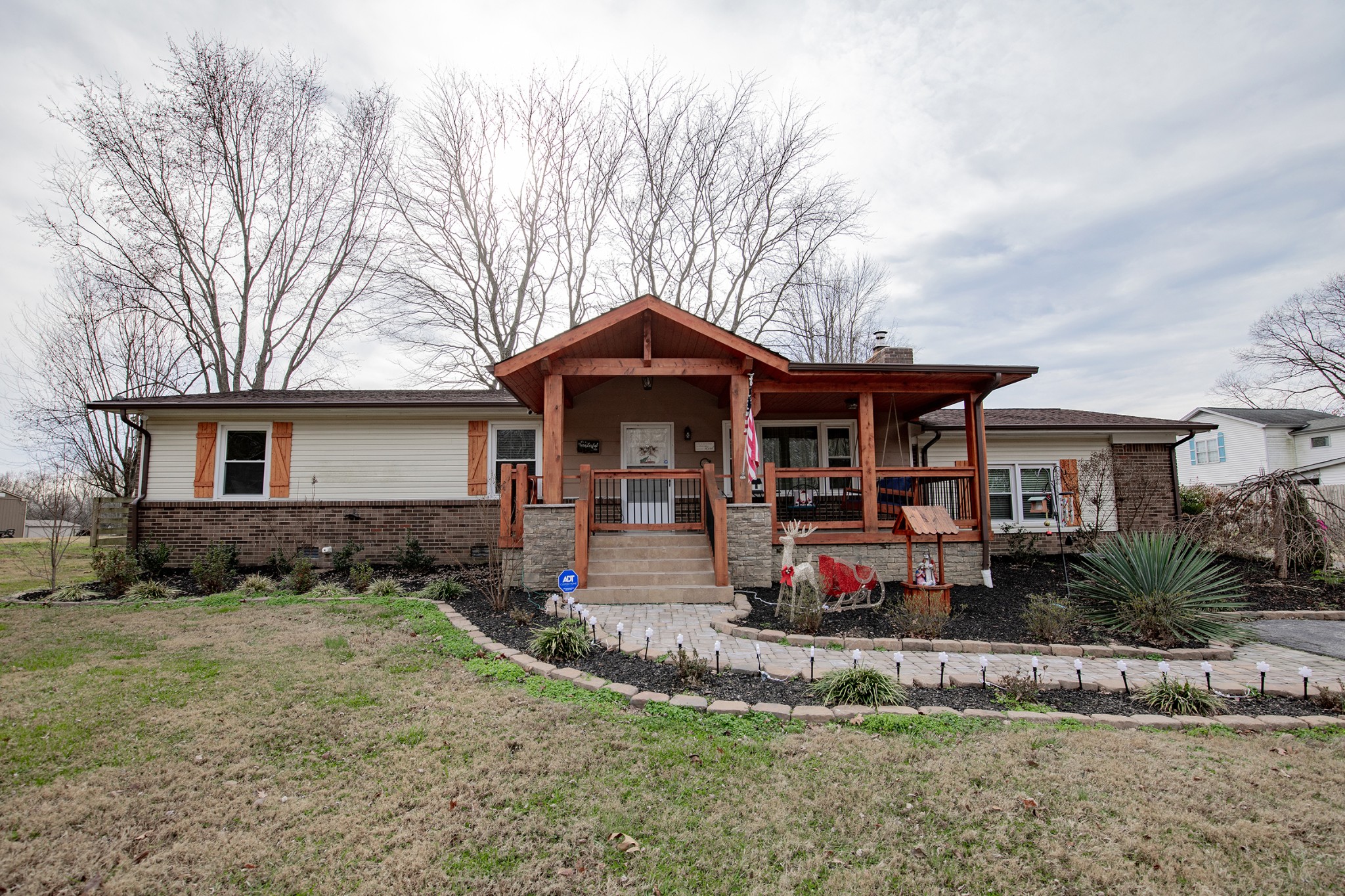 415 Lee Road Cottontown, TN 37048 - Photo 1 of 69 a front view of a house with garden