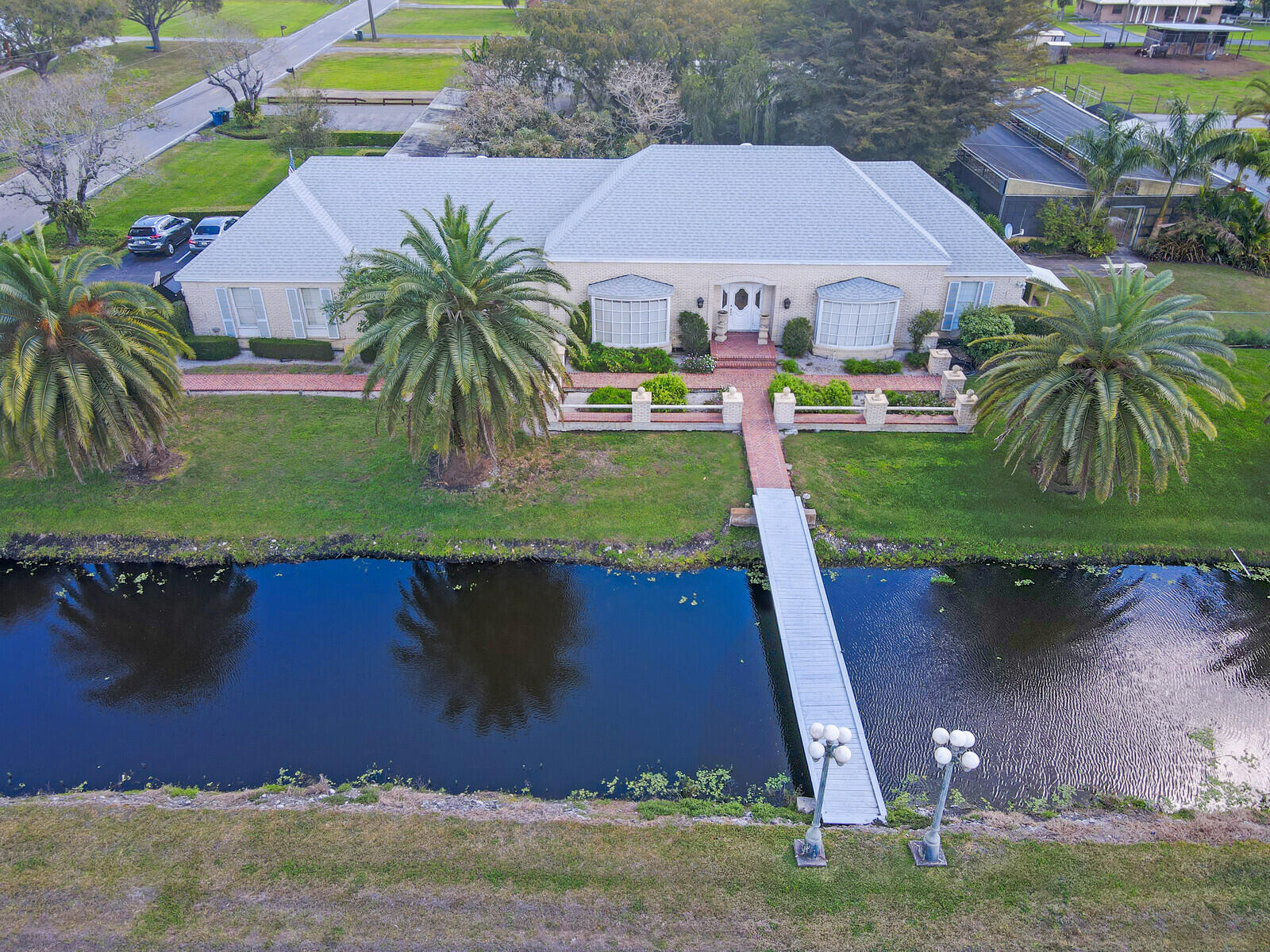 1101 Tabit Road Belle Glade, FL 33430 - Photo 1 of 43 Aerial front