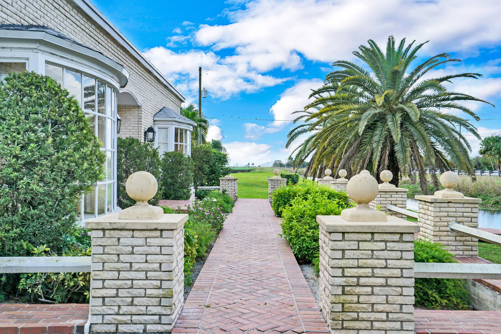 1101 Tabit Road Belle Glade, FL 33430 - Photo 2 of 43 front sidewalk