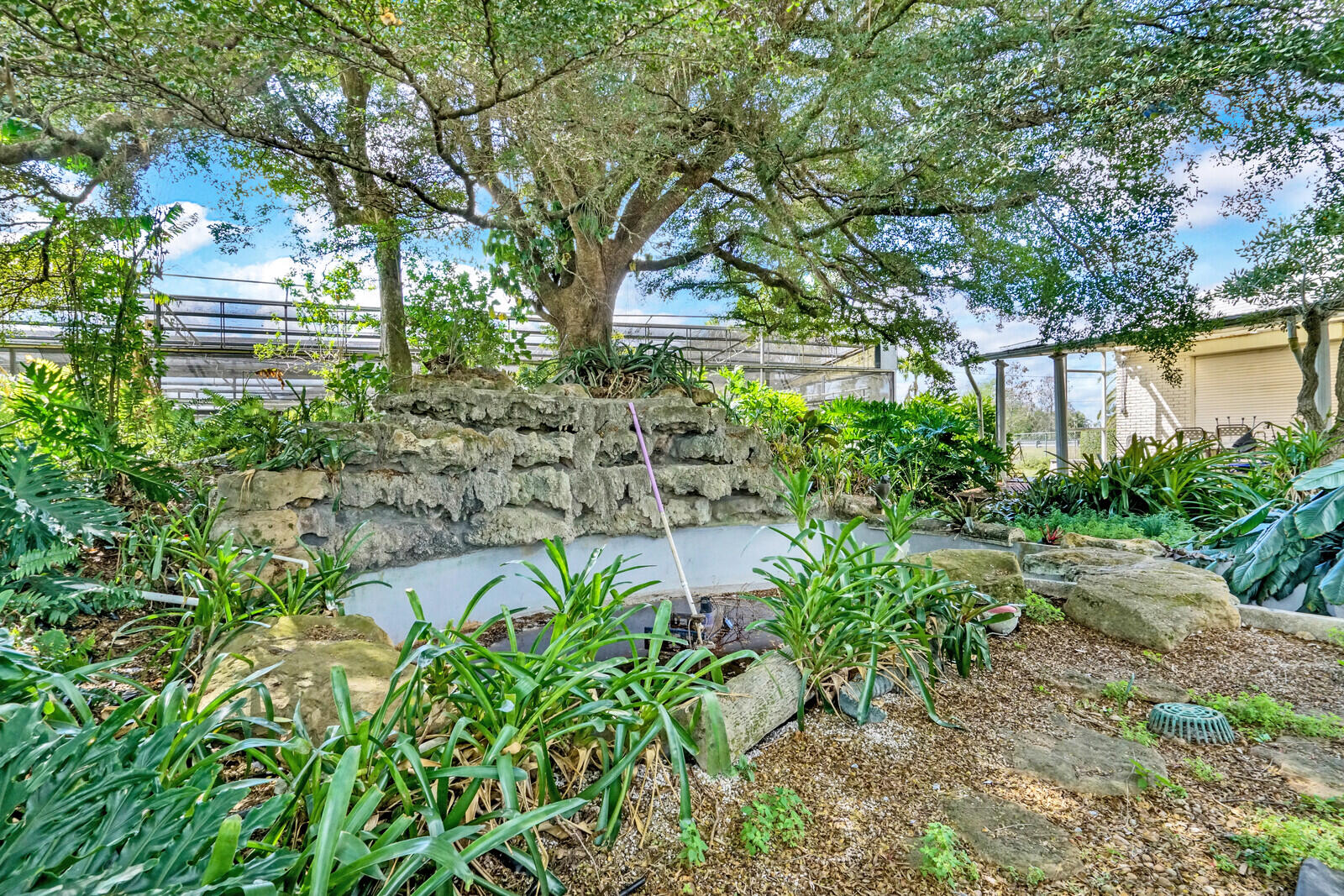1101 Tabit Road Belle Glade, FL 33430 - Photo 25 of 43 waterfall in garden