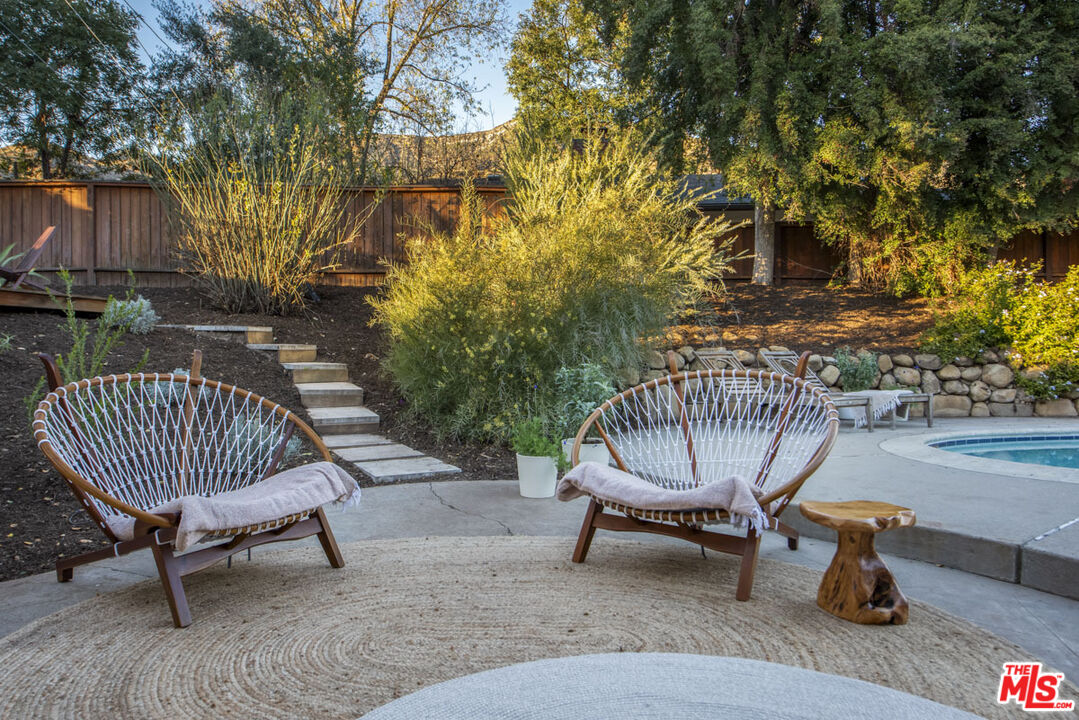 530 Pleasant Avenue Ojai, CA 93023 - Photo 21 of 29 a view of a chair and table in backyard of the house
