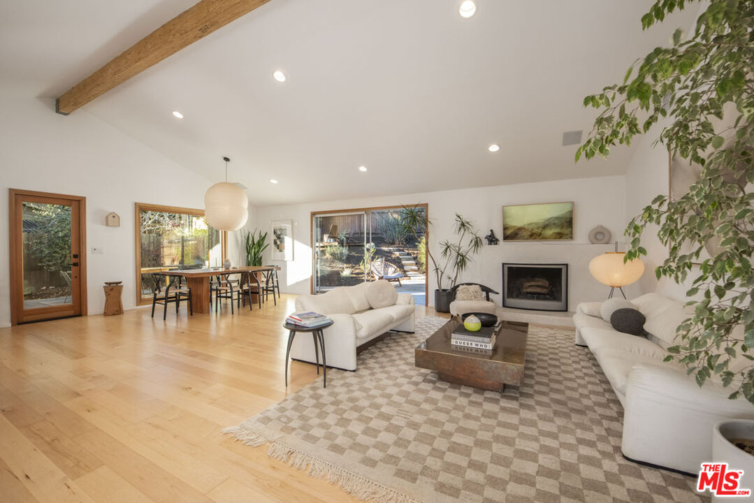 530 Pleasant Avenue Ojai, CA 93023 - Photo 5 of 29 a living room with fireplace furniture and a table