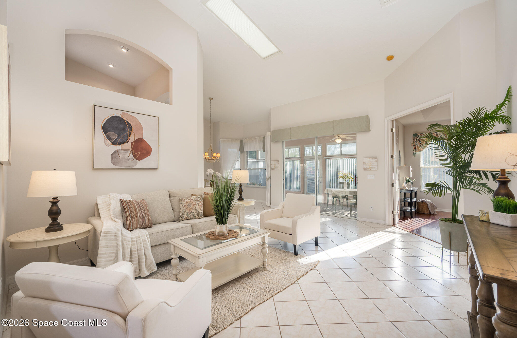 518 Renaissance Avenue Melbourne, FL 32940 - Photo 2 of 26 a living room with furniture and a large window