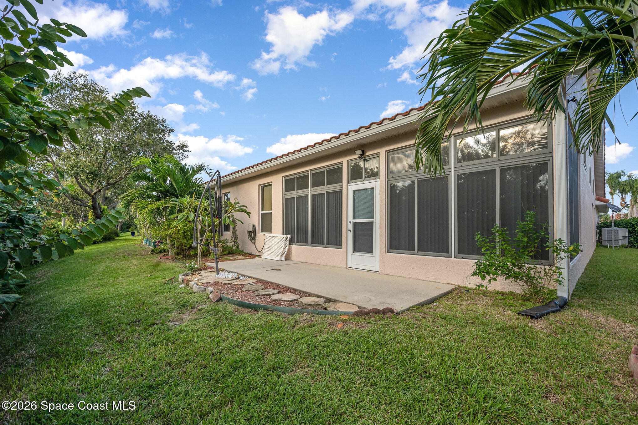 518 Renaissance Avenue Melbourne, FL 32940 - Photo 22 of 26 a view of house with backyard and glass windows