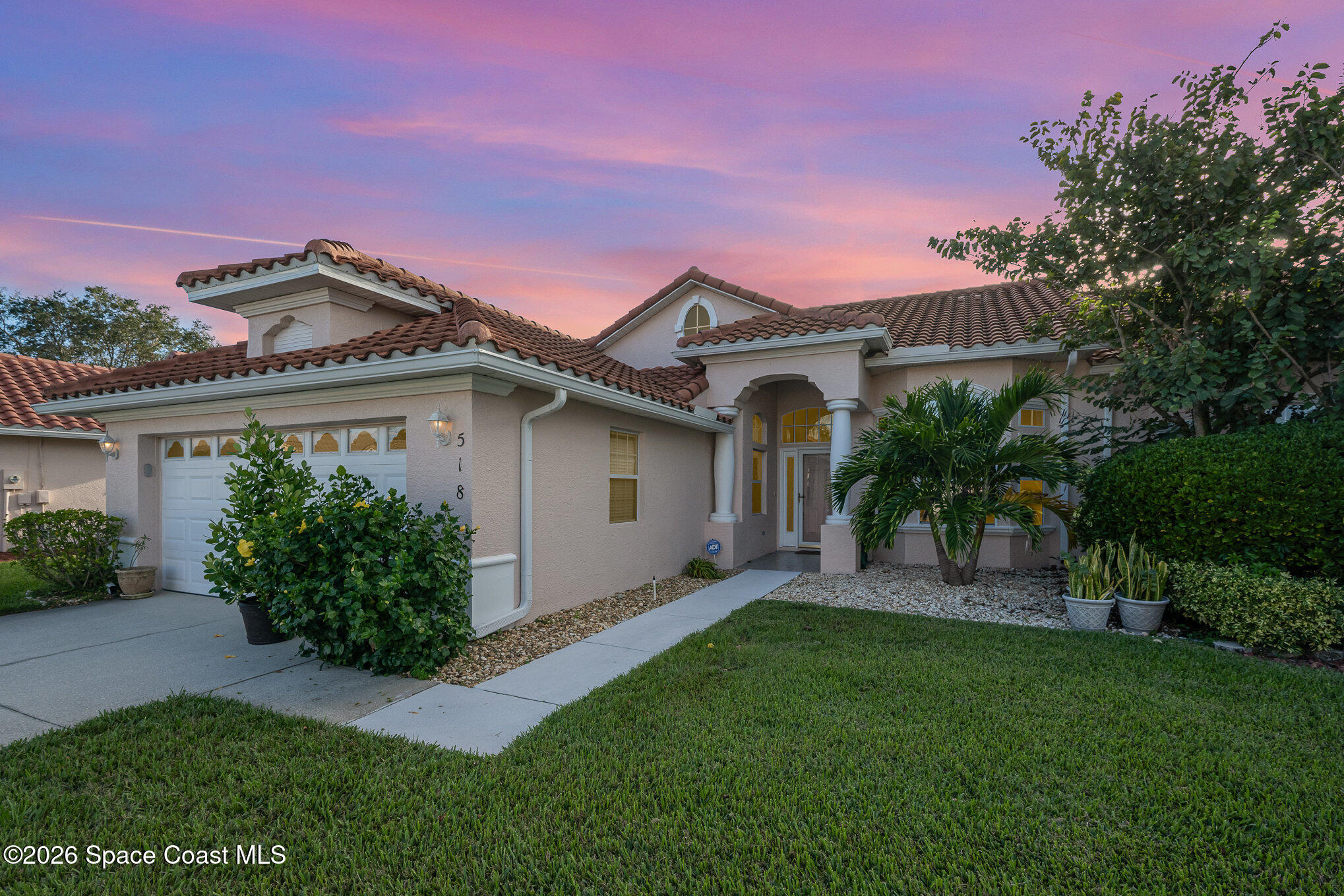 518 Renaissance Avenue Melbourne, FL 32940 - Photo 26 of 26 a front view of a house with a garden and plants