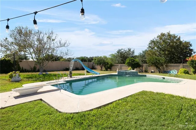 a view of a garden with houses