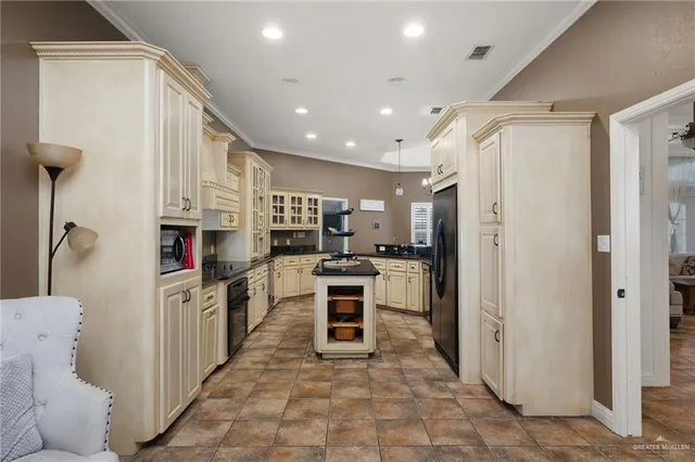 a kitchen with stainless steel appliances a refrigerator and a stove