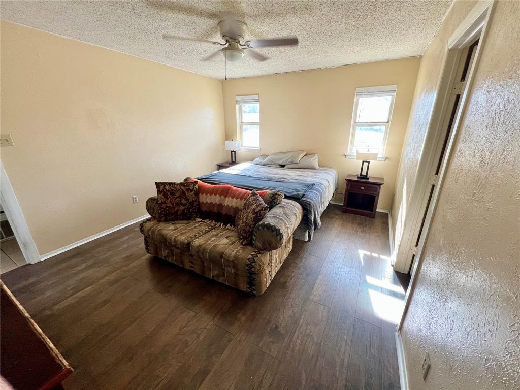 2805 Scott Mill Road Carrollton, TX 75007 - Photo 11 of 19 a spacious bedroom with a bed and a window