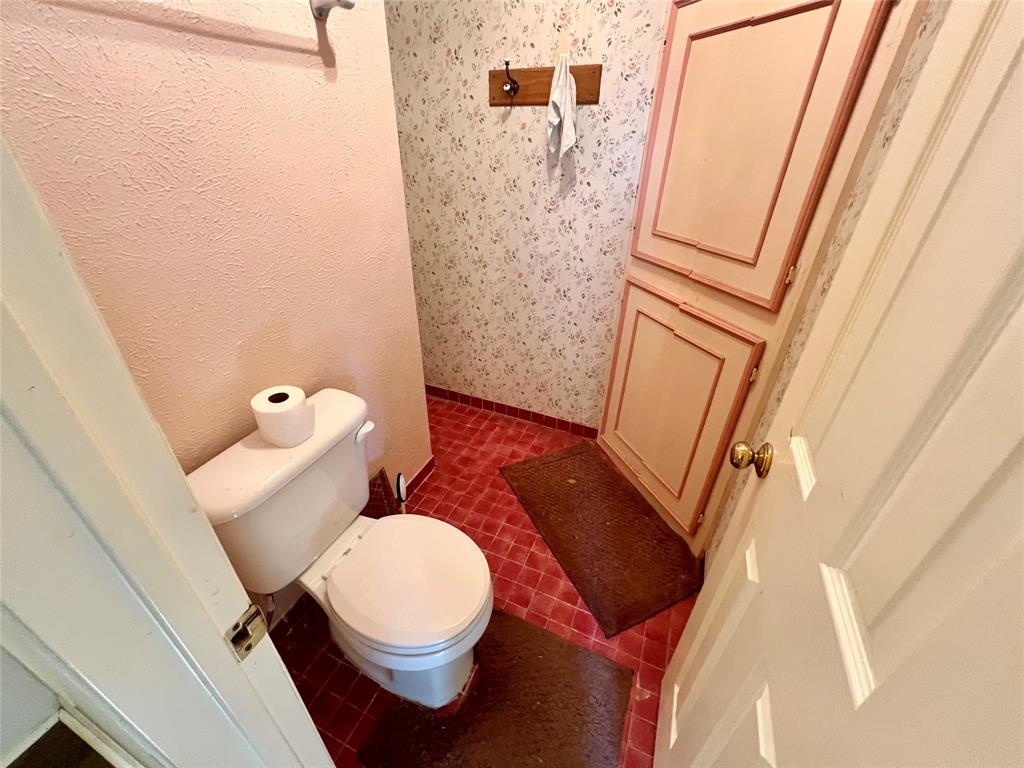 2805 Scott Mill Road Carrollton, TX 75007 - Photo 14 of 19 a white toilet sitting next to a sink