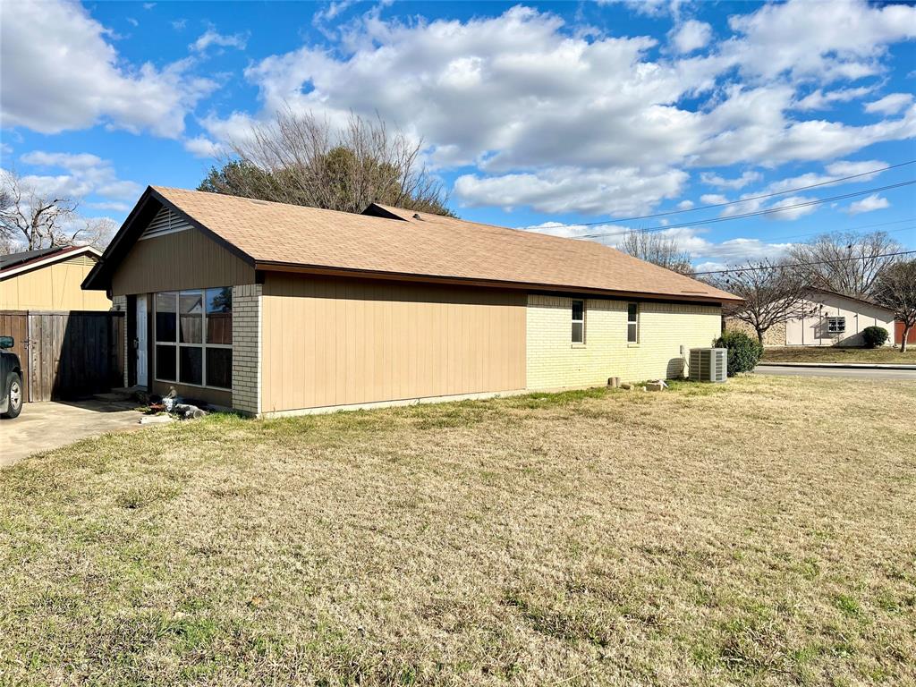 2805 Scott Mill Road Carrollton, TX 75007 - Photo 19 of 19 a front view of a house with a garden