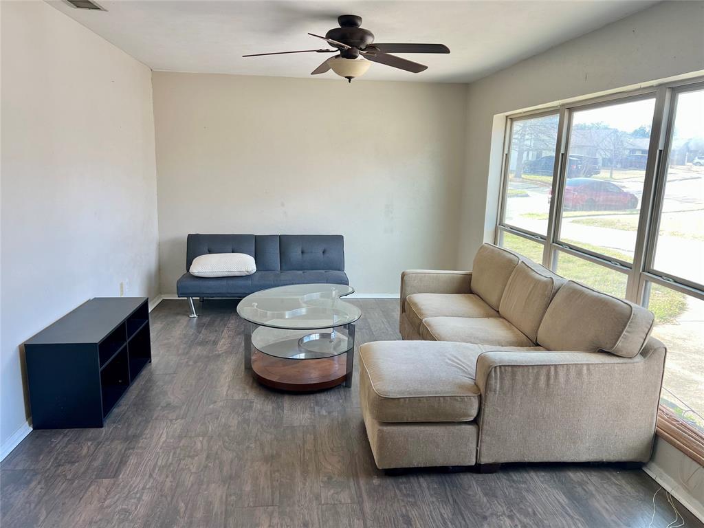 2805 Scott Mill Road Carrollton, TX 75007 - Photo 4 of 19 a living room with furniture and a large window