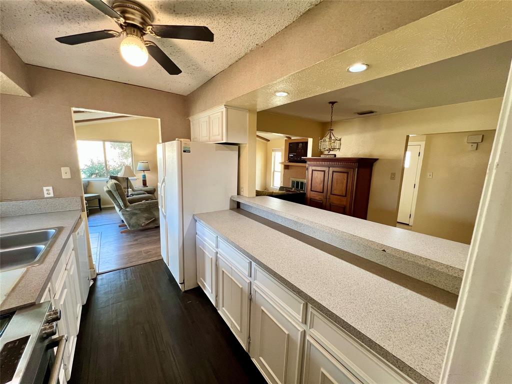 2805 Scott Mill Road Carrollton, TX 75007 - Photo 5 of 19 a kitchen with sink a refrigerator and a stove