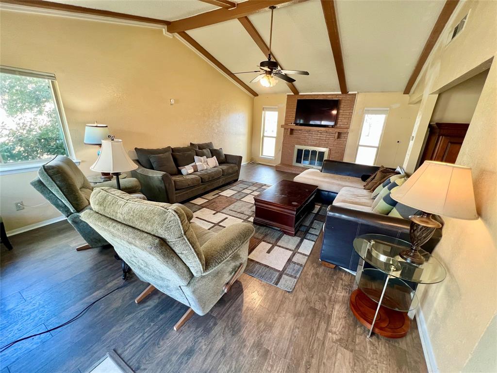 2805 Scott Mill Road Carrollton, TX 75007 - Photo 6 of 19 a living room with furniture and a fireplace