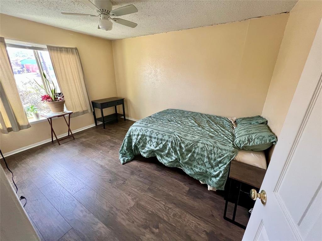 2805 Scott Mill Road Carrollton, TX 75007 - Photo 10 of 19 a living room with furniture and a wooden floor