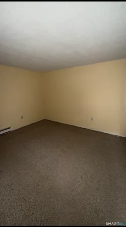 an empty room with a bench