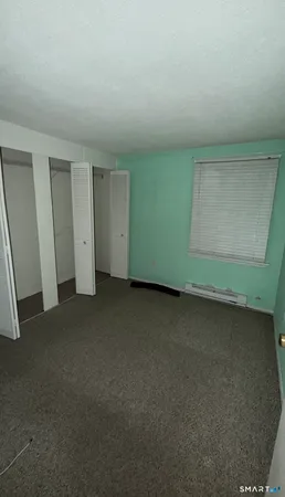 an empty room with a fireplace