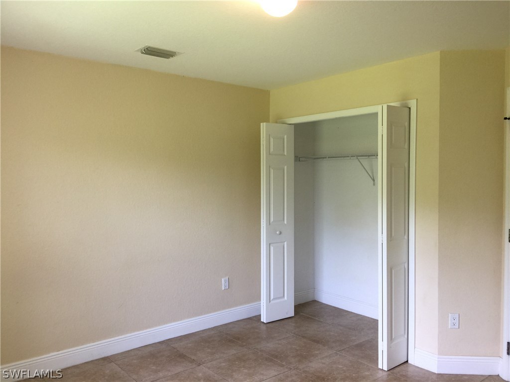 4015 36th Street Southwest Lehigh Acres, FL 33976 - Photo 16 of 23 a view of an empty room