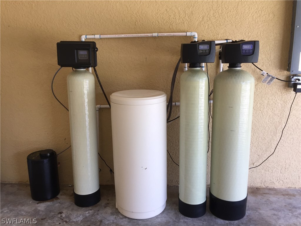 4015 36th Street Southwest Lehigh Acres, FL 33976 - Photo 19 of 23 a view of a room with water heater and refrigerator
