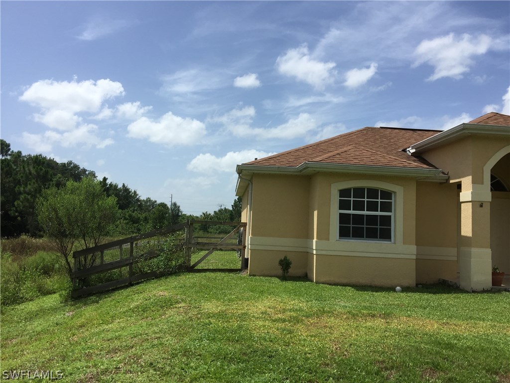 4015 36th Street Southwest Lehigh Acres, FL 33976 - Photo 2 of 23 a view of a backyard