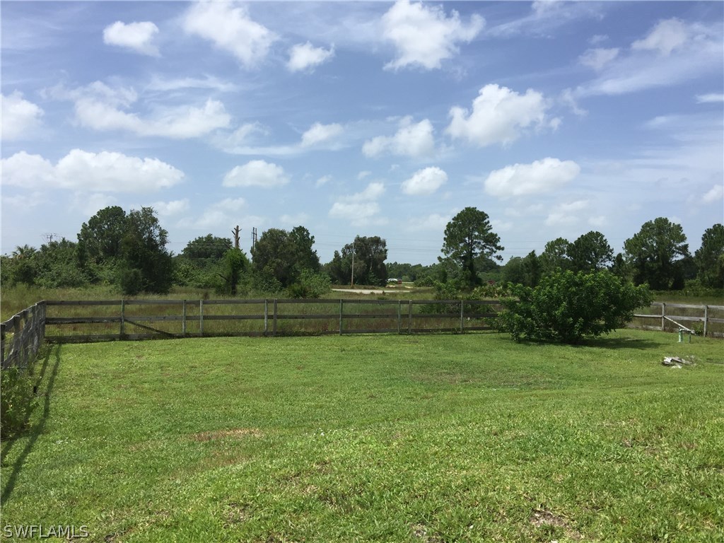 4015 36th Street Southwest Lehigh Acres, FL 33976 - Photo 22 of 23 a view of a golf course with a lake
