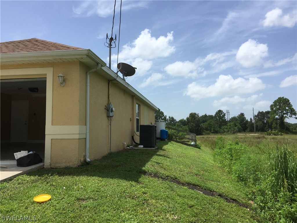 4015 36th Street Southwest Lehigh Acres, FL 33976 - Photo 3 of 23 a house view with a garden space