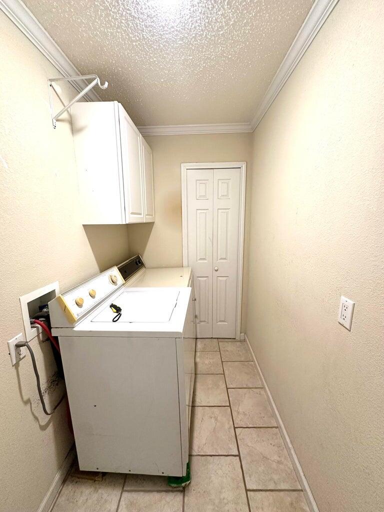 2615 West 19th Plainview, TX 79072 - Photo 12 of 15 a view of utility room with washer and dryer