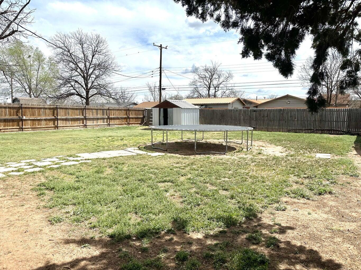 2615 West 19th Plainview, TX 79072 - Photo 15 of 15 a view of a large yard with an outdoor space
